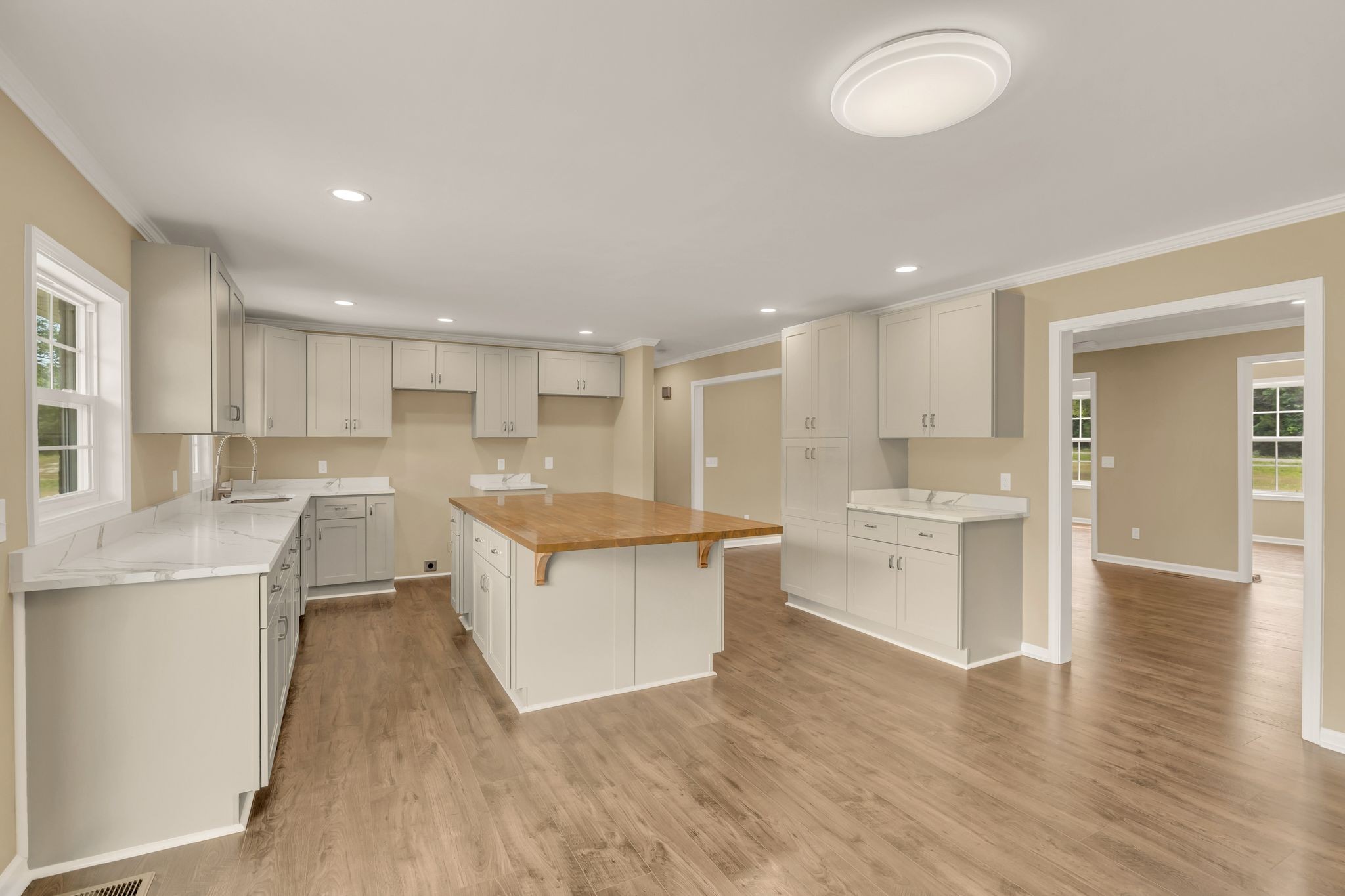 5065 Craddock Road Lascassas, TN 37085 - Photo 13 of 51 a large kitchen with cabinets and wooden floor