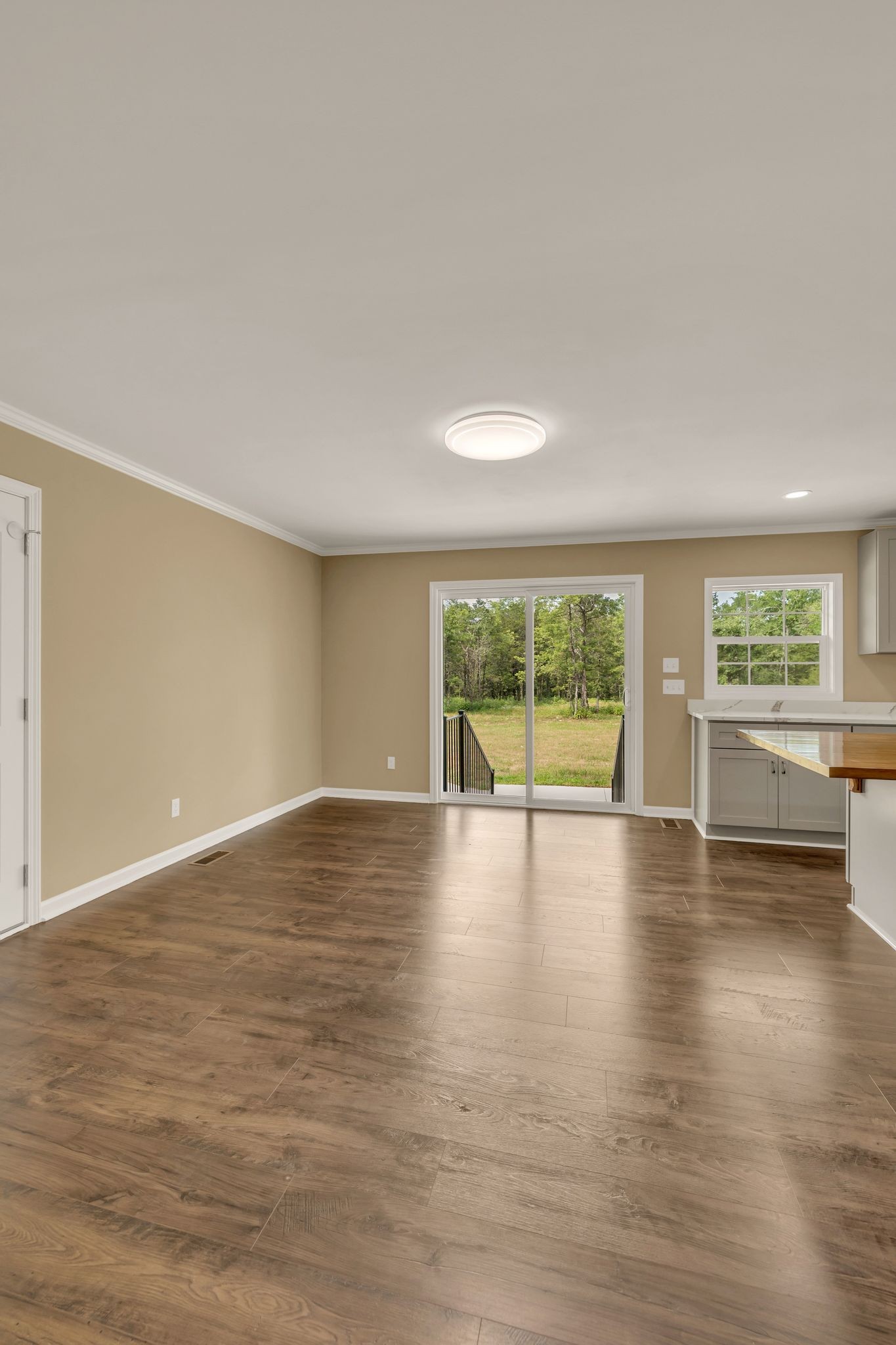 5065 Craddock Road Lascassas, TN 37085 - Photo 16 of 51 a view of empty room with wooden floor and fireplace