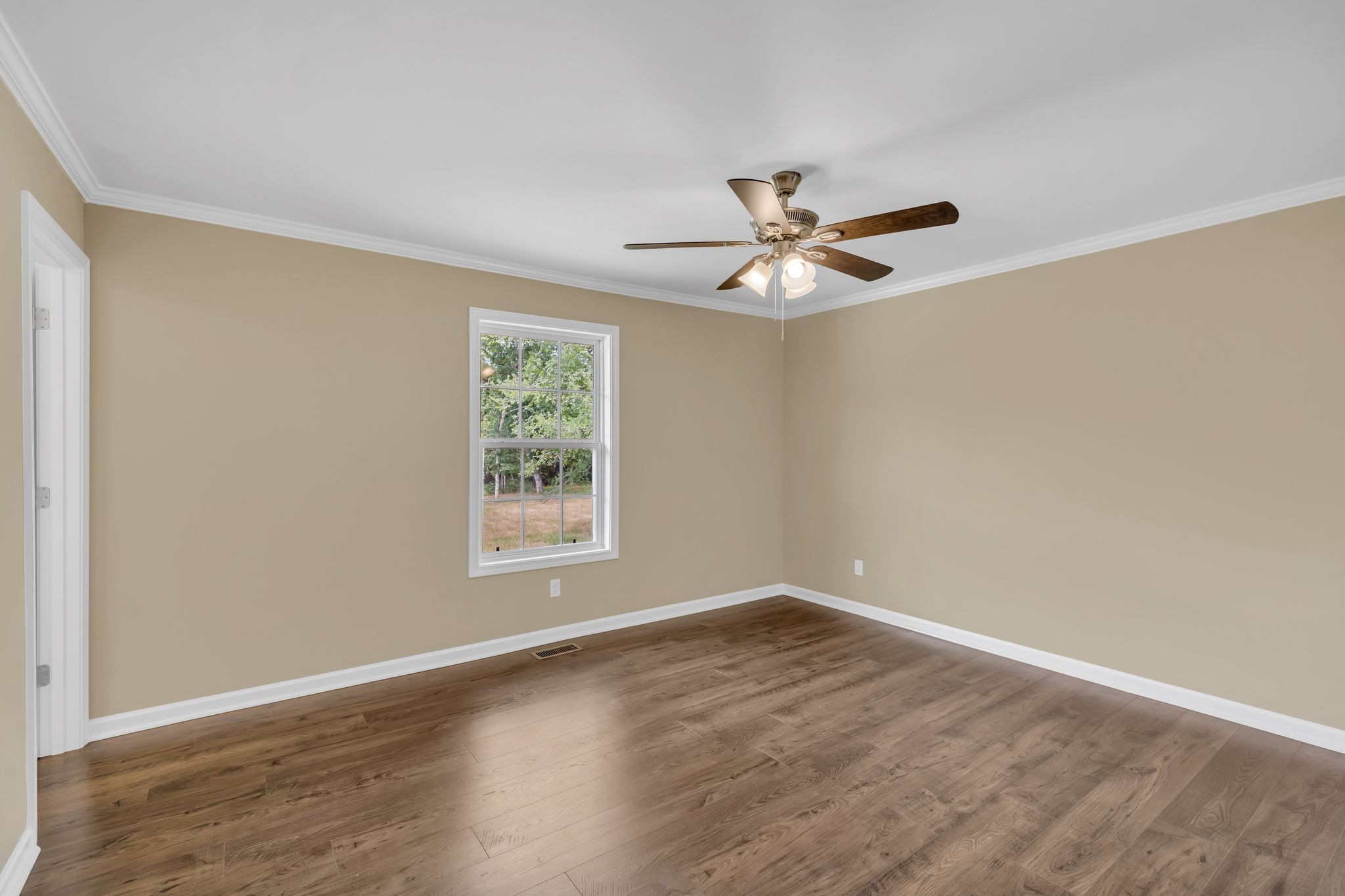 5065 Craddock Road Lascassas, TN 37085 - Photo 19 of 51 an empty room with wooden floor and ceiling fan