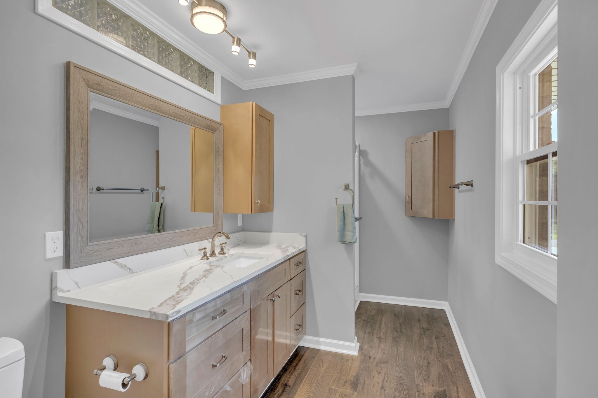 5065 Craddock Road Lascassas, TN 37085 - Photo 23 of 51 a spacious bathroom with a granite countertop sink and a mirror