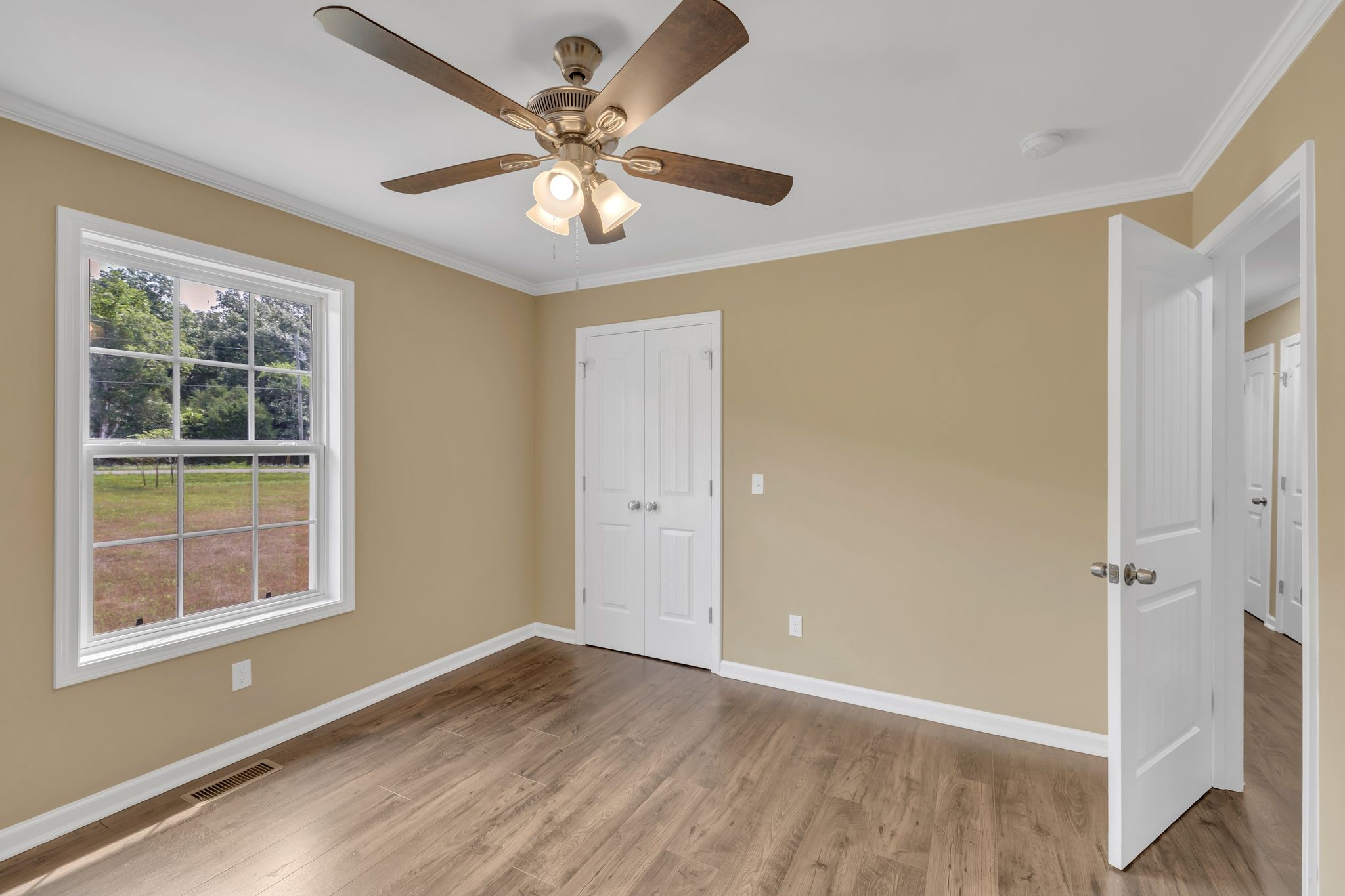 5065 Craddock Road Lascassas, TN 37085 - Photo 26 of 51 a view of an empty room with a window and wooden floor