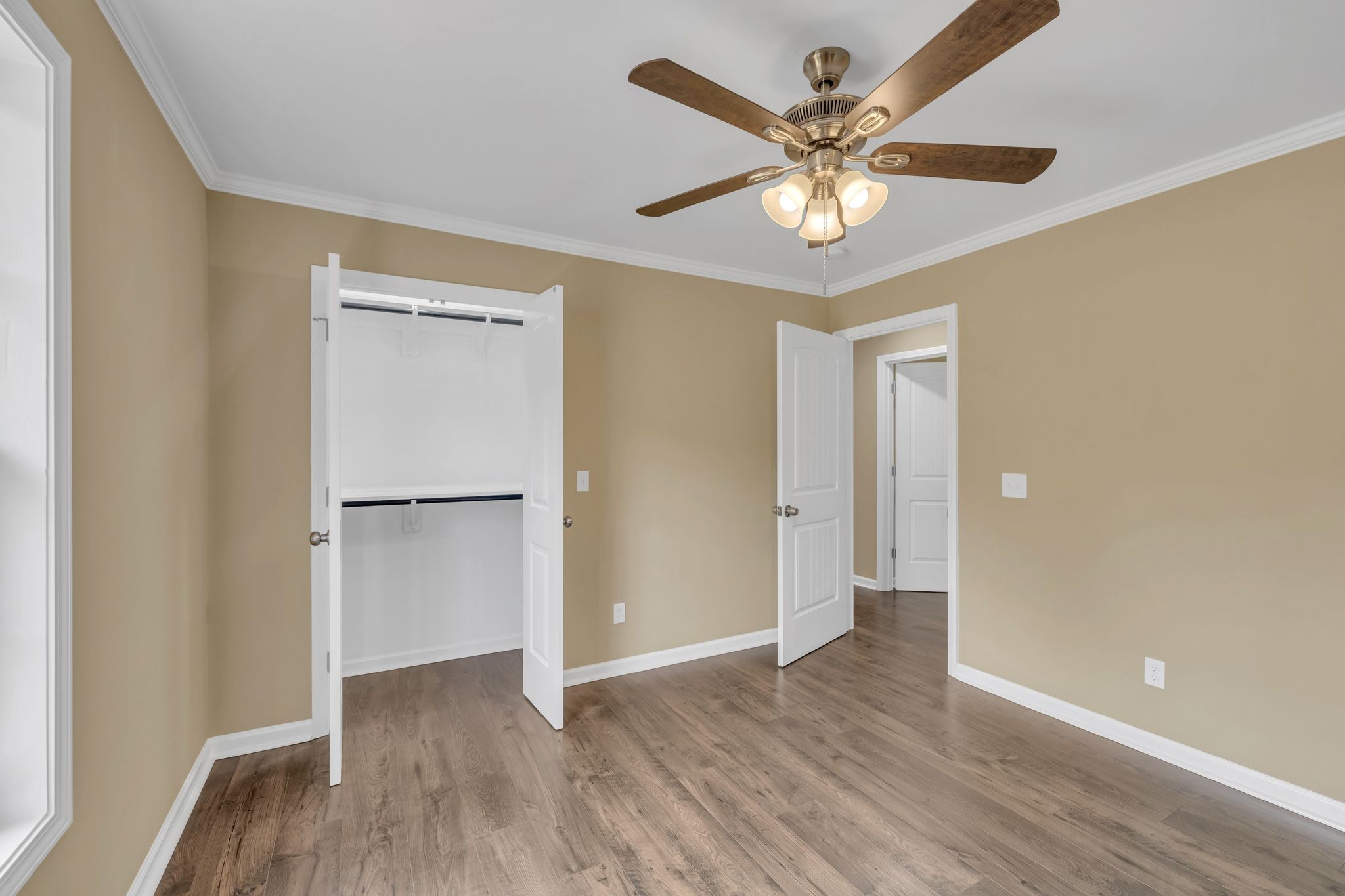 5065 Craddock Road Lascassas, TN 37085 - Photo 27 of 51 a view of an empty room with wooden floor and a ceiling fan