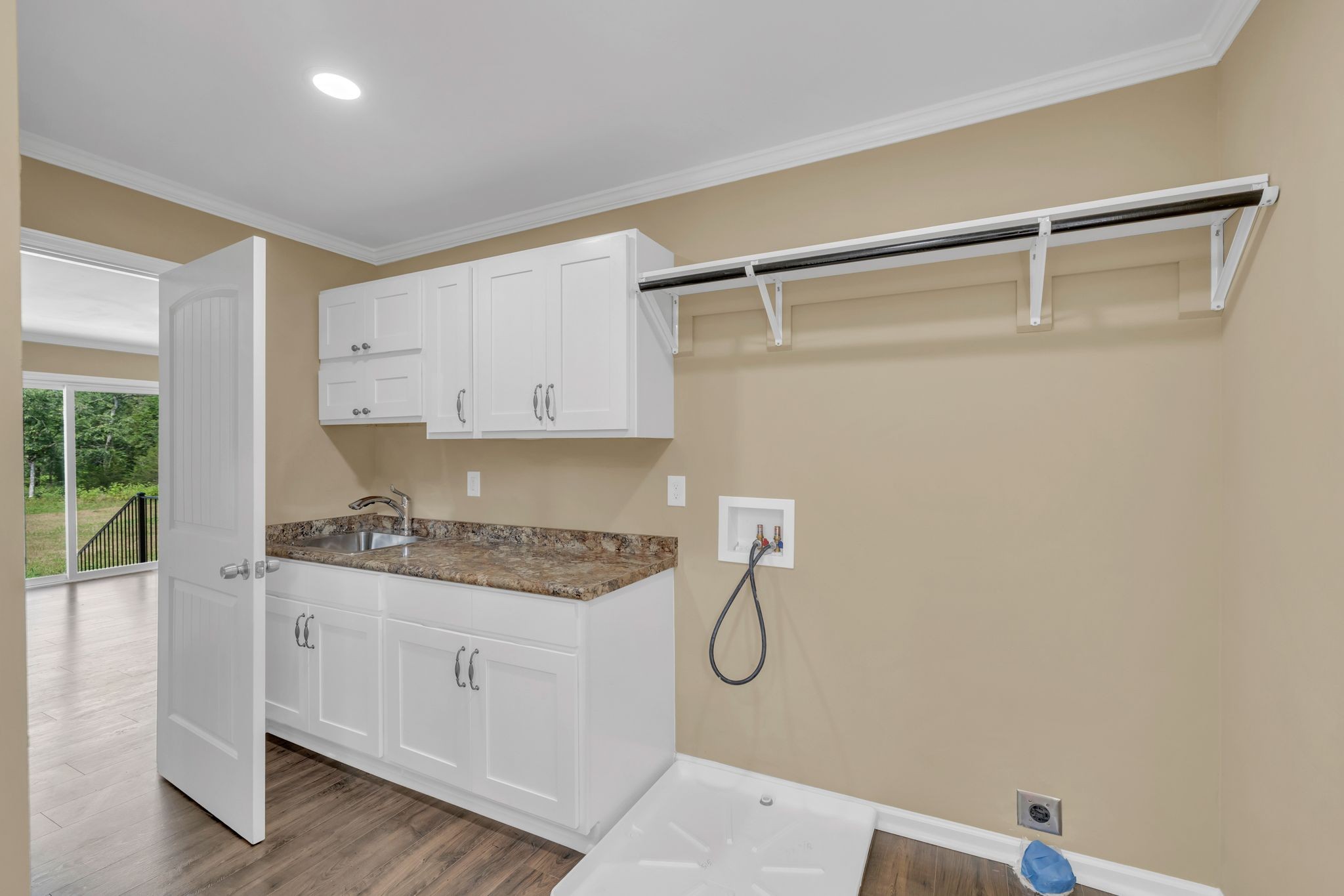 5065 Craddock Road Lascassas, TN 37085 - Photo 31 of 51 a kitchen with white cabinets and white appliances
