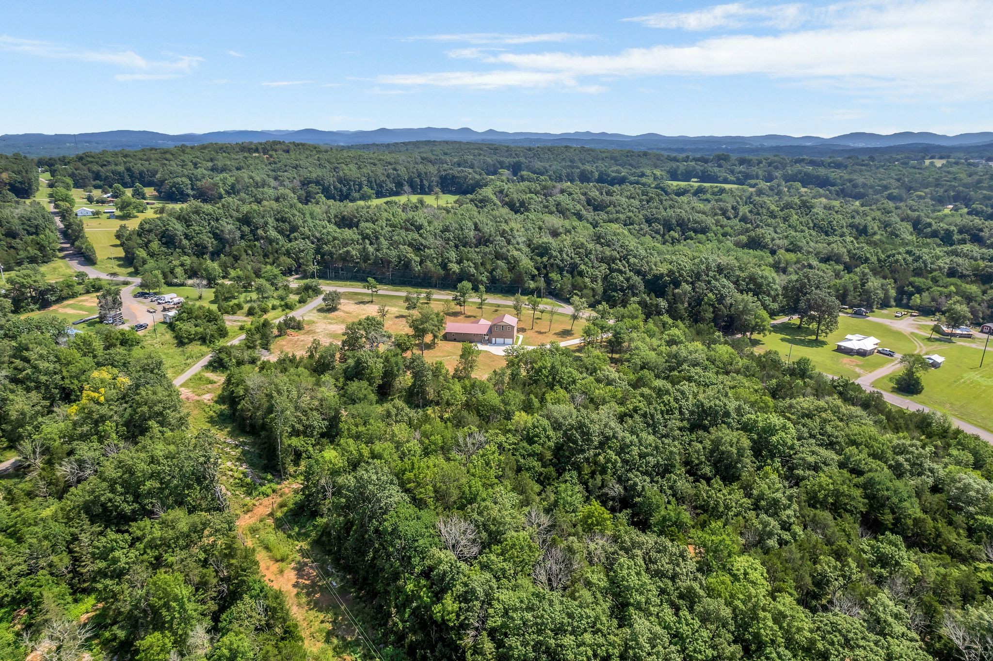 5065 Craddock Road Lascassas, TN 37085 - Photo 48 of 51 a view of a lush green field with trees in the background