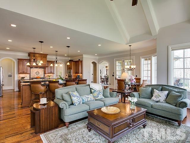6037 Over Hadden Court Raleigh, NC 27614 - Photo 11 of 25 a living room with furniture kitchen view and a table