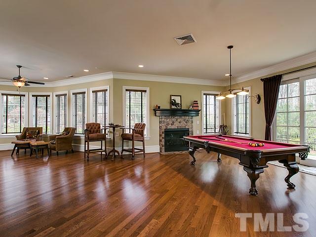 6037 Over Hadden Court Raleigh, NC 27614 - Photo 15 of 25 a living room with furniture pool table and a fireplace