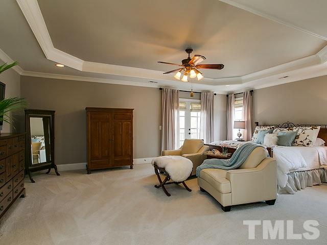 6037 Over Hadden Court Raleigh, NC 27614 - Photo 17 of 25 a living room with furniture and a chandelier