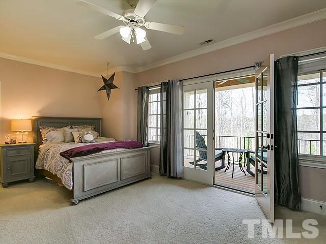 6037 Over Hadden Court Raleigh, NC 27614 - Photo 25 of 25 a living room with a bed furniture and a chandelier