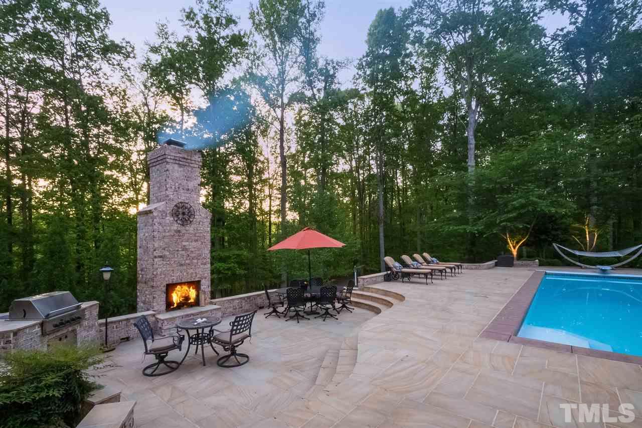 6037 Over Hadden Court Raleigh, NC 27614 - Photo 5 of 25 an outdoor space with furniture and umbrella