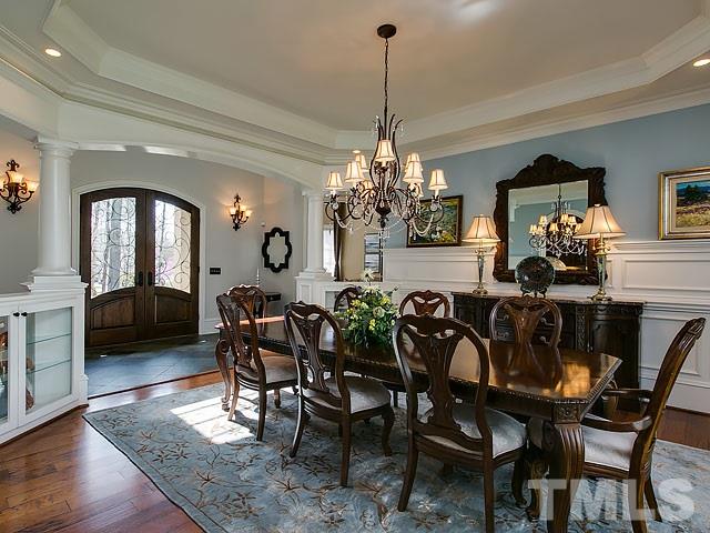 6037 Over Hadden Court Raleigh, NC 27614 - Photo 7 of 25 a view of a dining room with furniture and chandelier