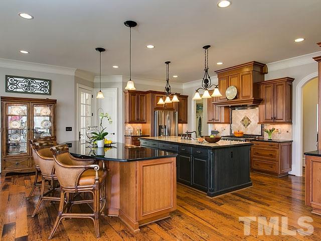 6037 Over Hadden Court Raleigh, NC 27614 - Photo 10 of 25 a large kitchen with lots of counter space and dining table