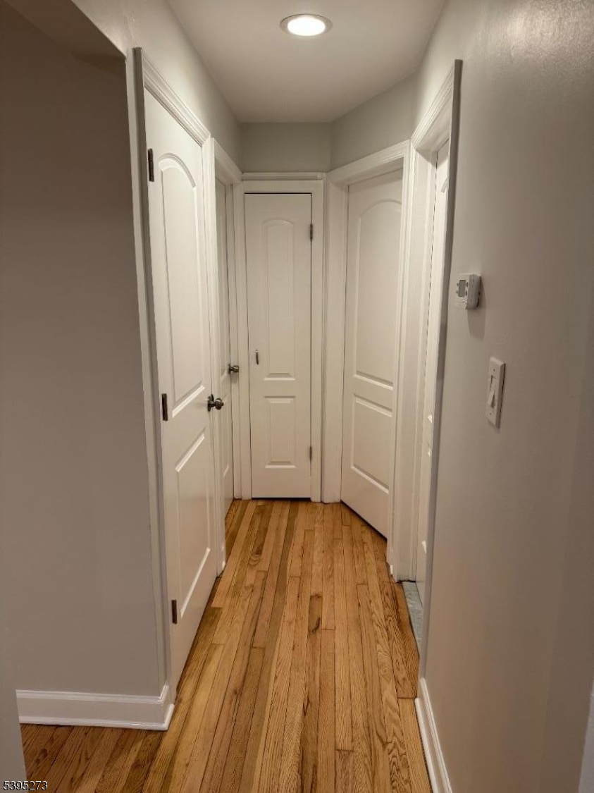 2 Woodside Avenue, Unit 1 Little Falls, NJ 07424 - Photo 4 of 13 a view of a room with wooden floor and a small space