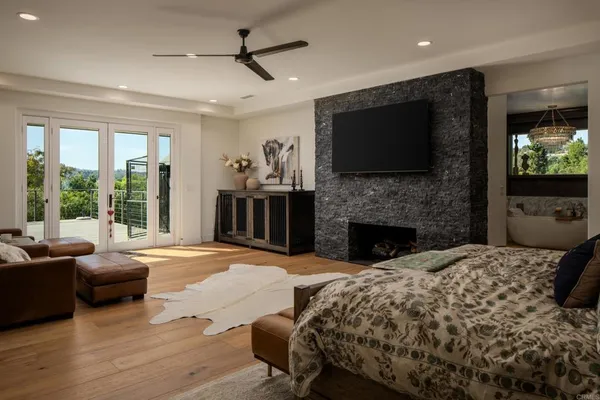 a bed room with a bed and a television