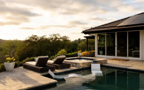 a outdoor space with patio couch and a potted plant