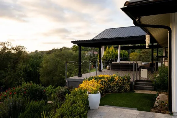 a view of a chair and table in the garden and yard