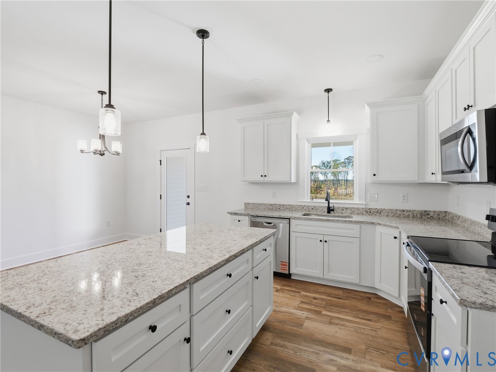 3706 Broad St Road Gum Spring, VA 23065 - Photo 8 of 34 a kitchen with granite countertop white cabinets and a sink