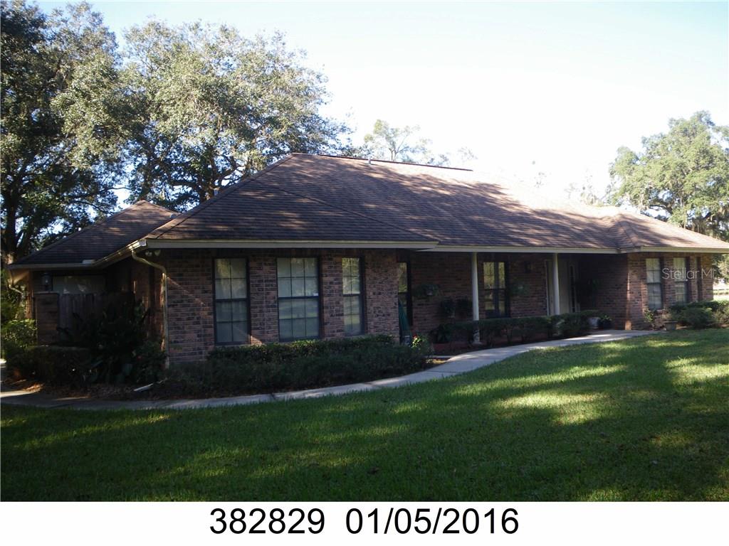 3485 Saturn Road Brooksville, FL 34604 - Photo 1 of 1 a view of a house with a garden