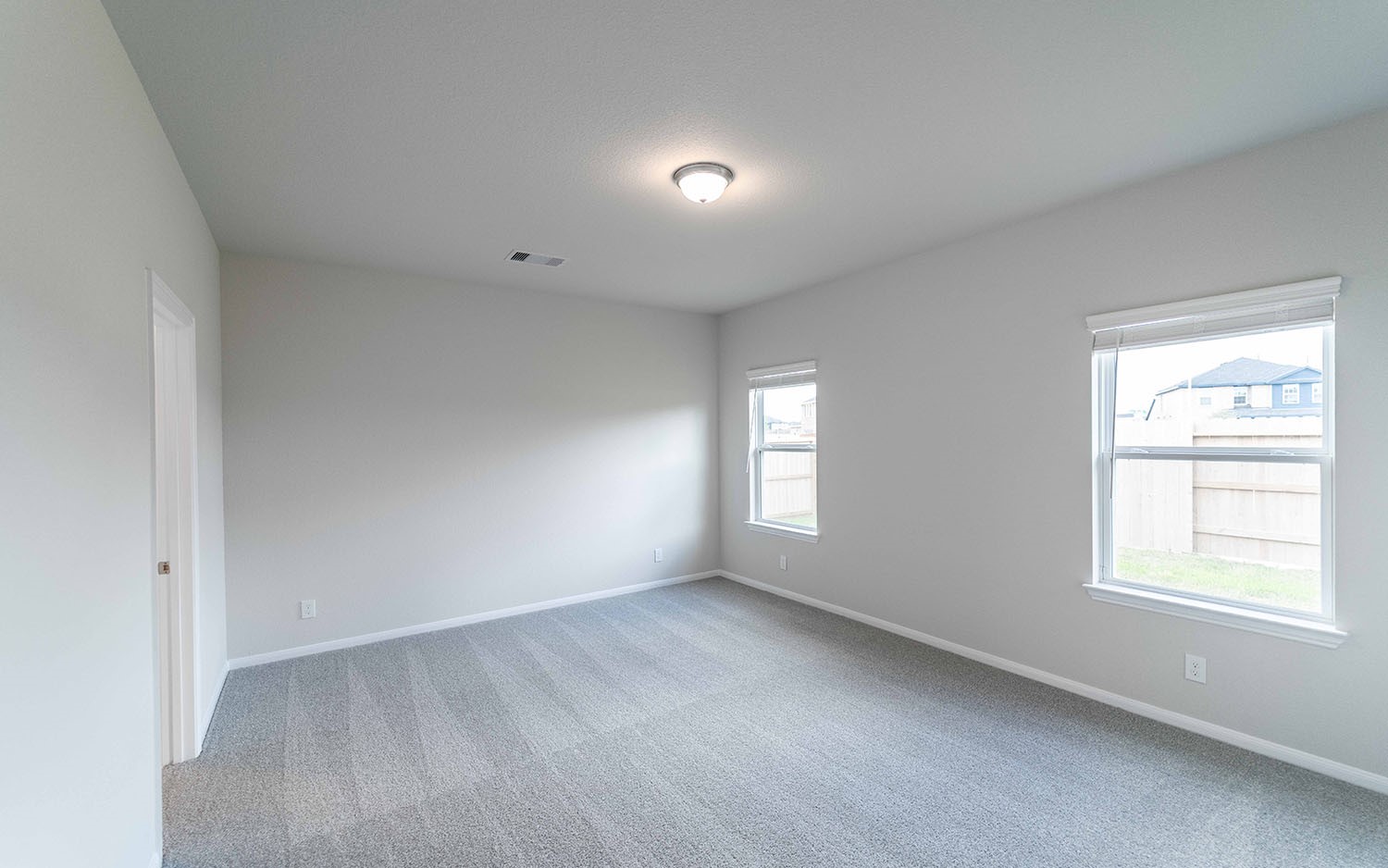 22222 Rome Breeze Drive Hockley, TX 77447 - Photo 11 of 16 a view of an empty room with a window