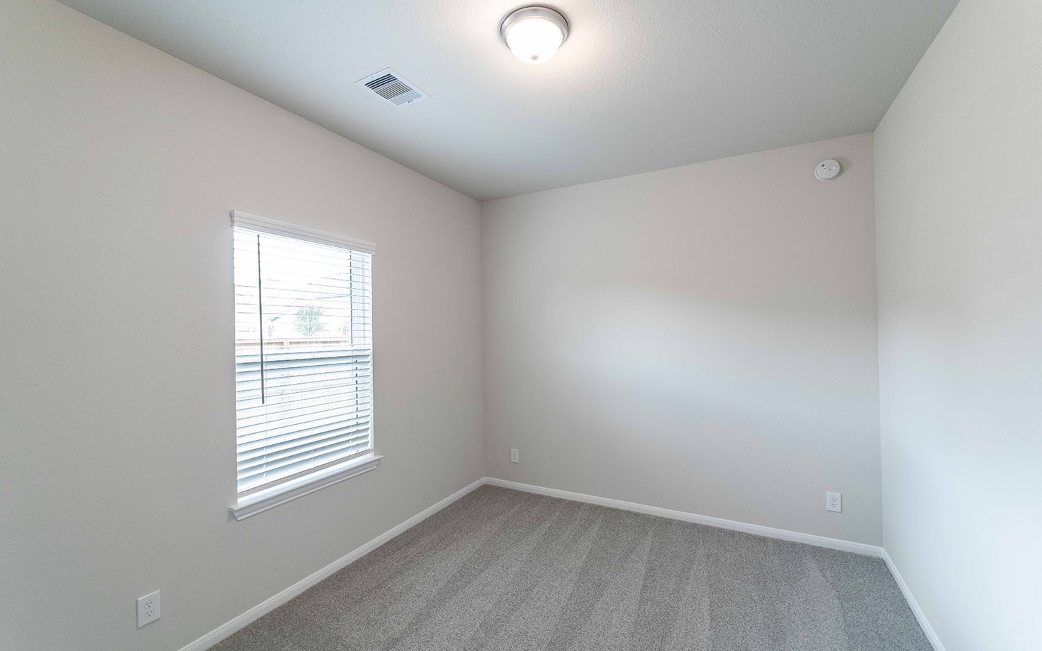 22222 Rome Breeze Drive Hockley, TX 77447 - Photo 12 of 16 an empty room with windows