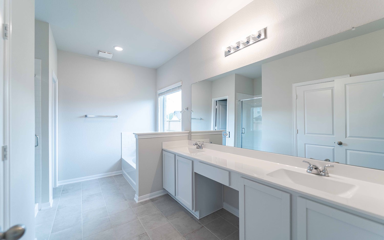 22222 Rome Breeze Drive Hockley, TX 77447 - Photo 15 of 16 a bathroom with a sink double vanity and a mirror