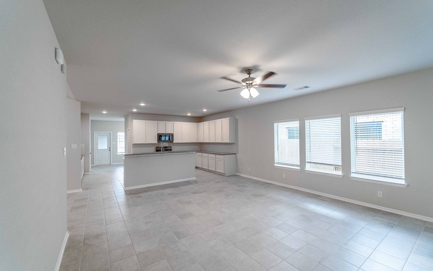 22222 Rome Breeze Drive Hockley, TX 77447 - Photo 3 of 16 a view of a kitchen with a sink and cabinets