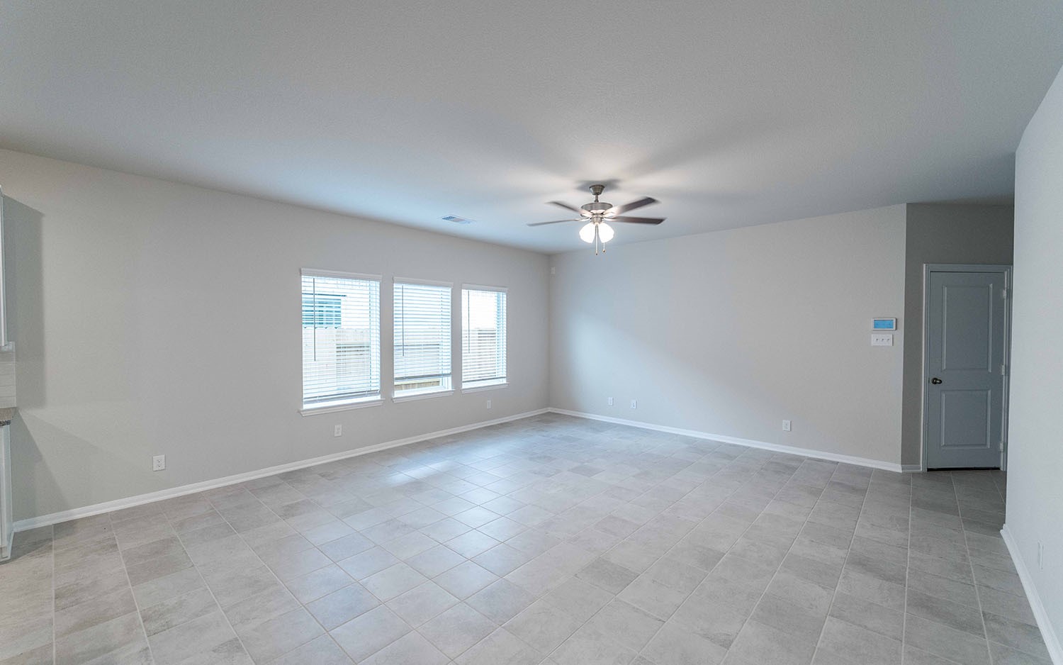 22222 Rome Breeze Drive Hockley, TX 77447 - Photo 5 of 16 a view of an empty room with a window