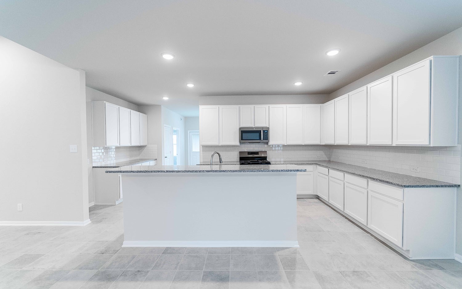 22222 Rome Breeze Drive Hockley, TX 77447 - Photo 6 of 16 a large kitchen with cabinets