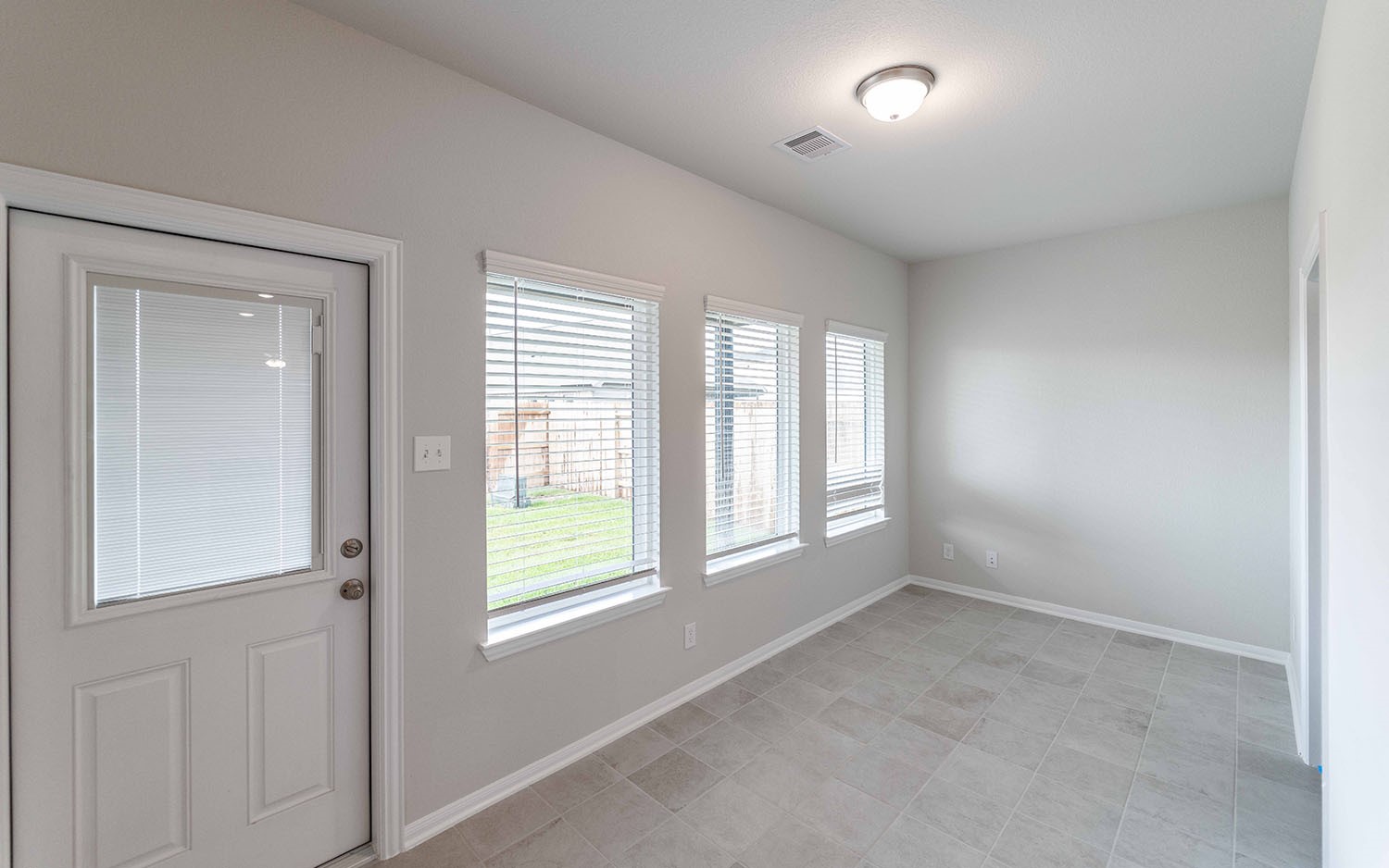 22222 Rome Breeze Drive Hockley, TX 77447 - Photo 10 of 16 a view of an empty room with a window