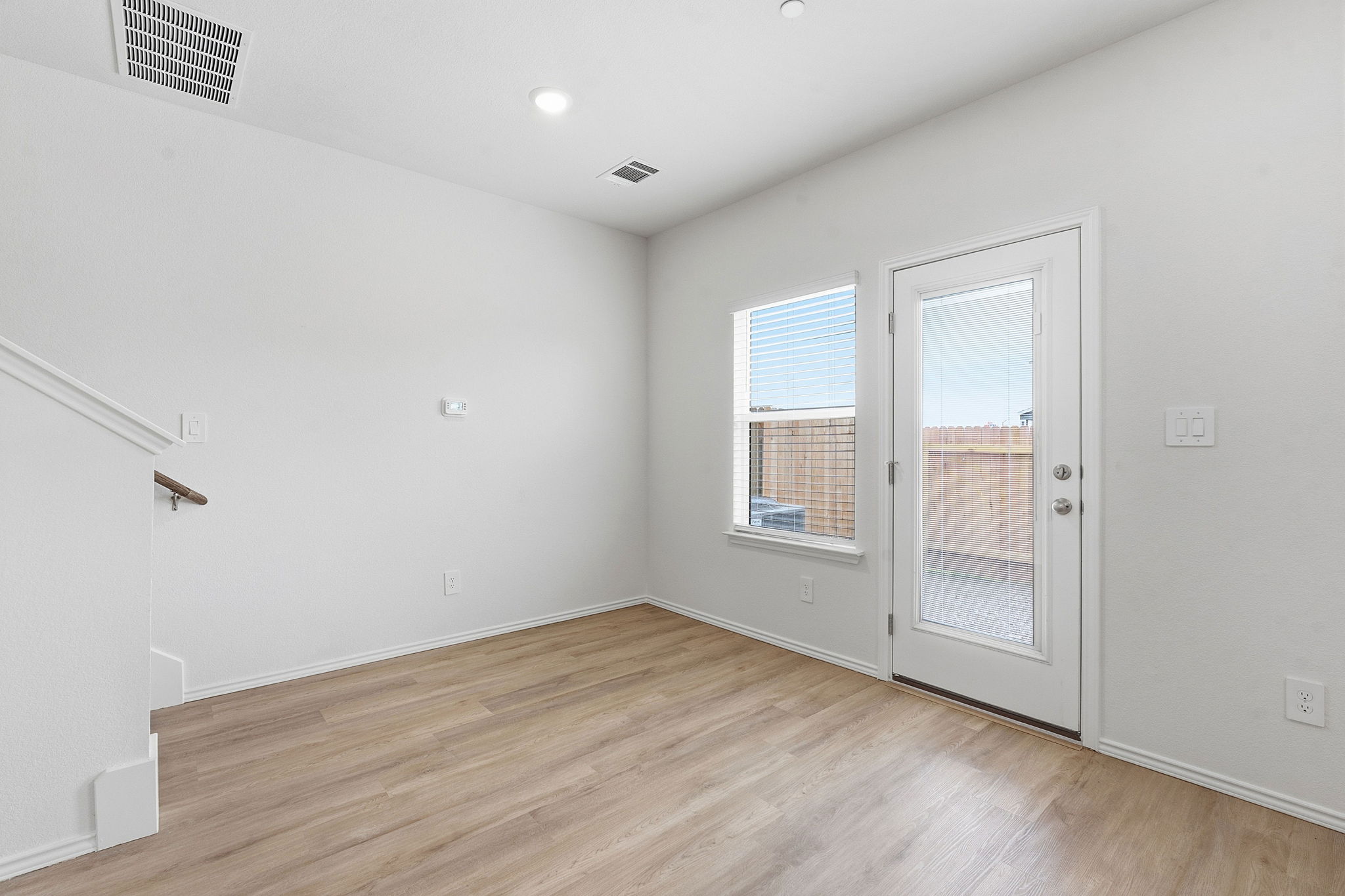 164 Cinnabar Lane, Unit 4 Kyle, TX 78640 - Photo 10 of 23 Room with wood-finish flooring, white walls, and recessed lighting