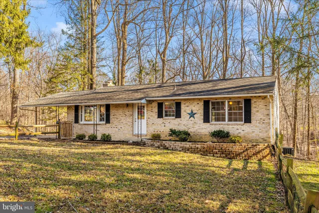 a front view of a house with yard