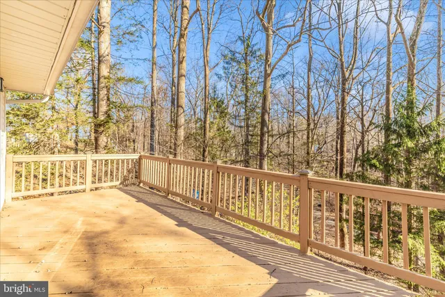 a view of a balcony with trees