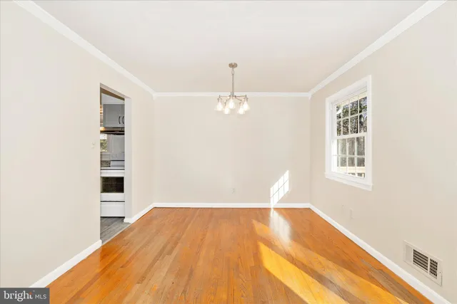 a view of a room with wooden floor and staircase