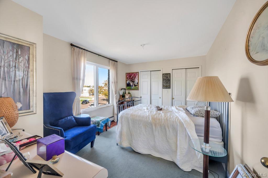 3142 Shore Road Bellmore, NY 11710 - Photo 18 of 24 a bedroom with a bed and wooden floor