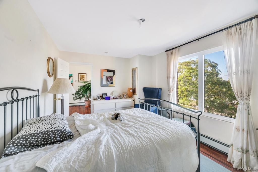 3142 Shore Road Bellmore, NY 11710 - Photo 19 of 24 a bedroom with a bed and a large window