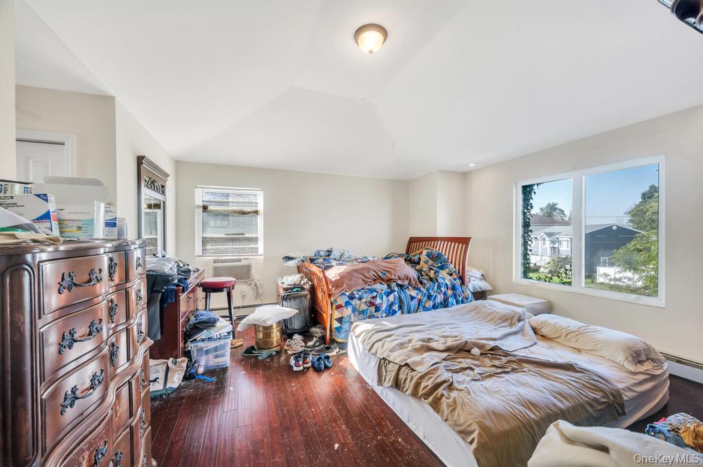 3142 Shore Road Bellmore, NY 11710 - Photo 20 of 24 a bedroom with furniture and a large window