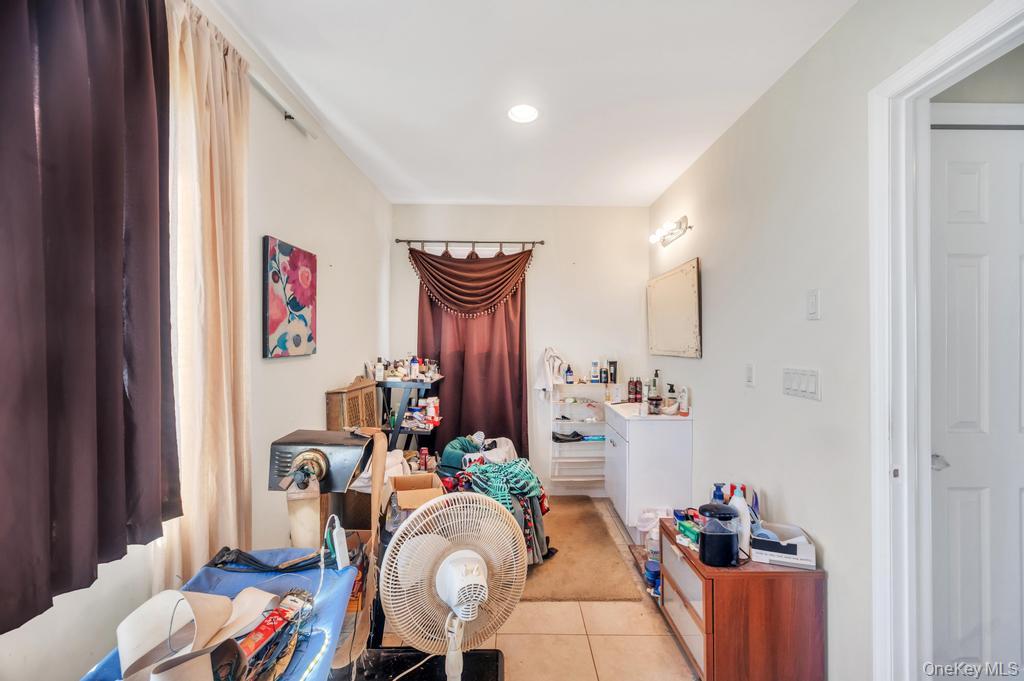 3142 Shore Road Bellmore, NY 11710 - Photo 21 of 24 a dining room with furniture and wooden floor