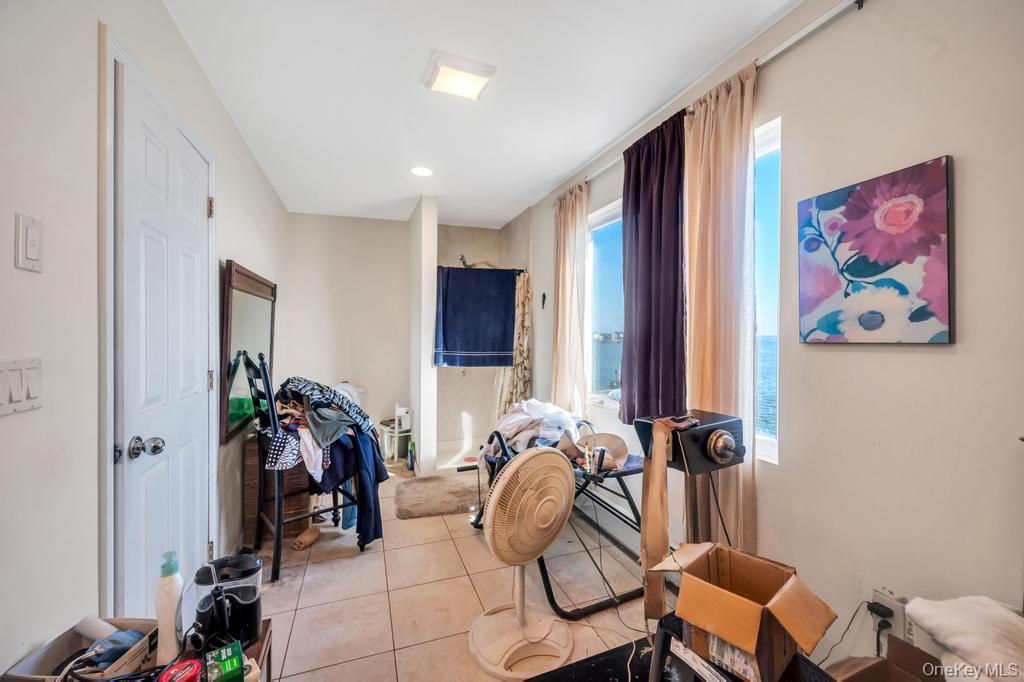 3142 Shore Road Bellmore, NY 11710 - Photo 22 of 24 a view of a livingroom with furniture and bedroom floor
