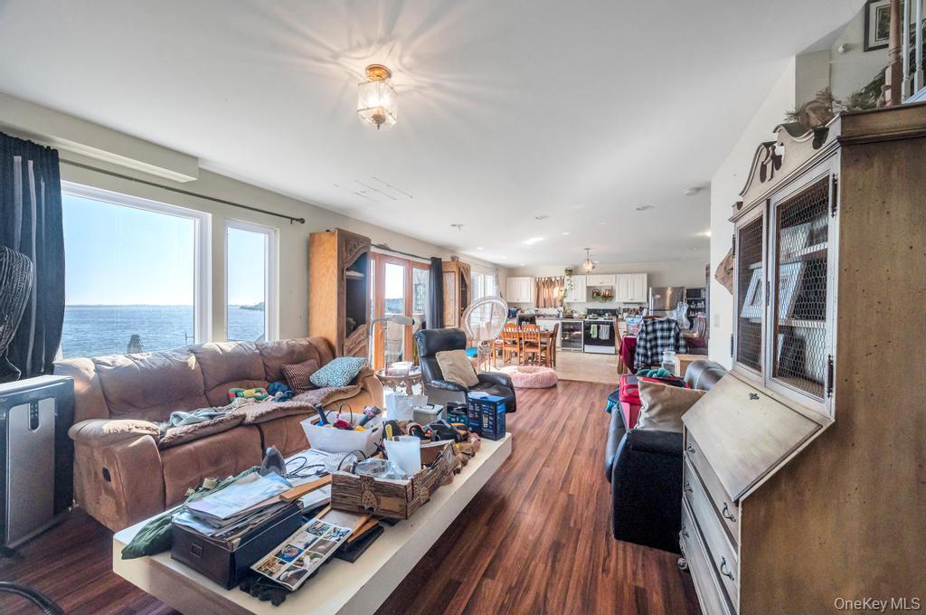 3142 Shore Road Bellmore, NY 11710 - Photo 4 of 24 a living room with furniture fireplace and a large window