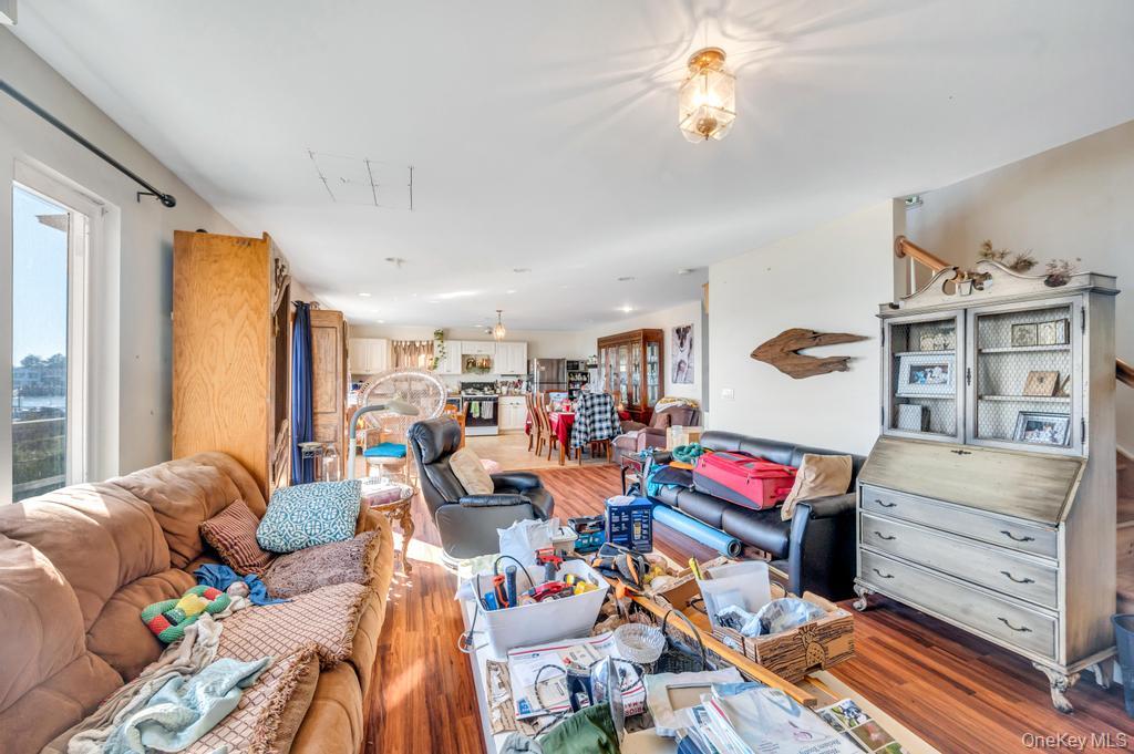 3142 Shore Road Bellmore, NY 11710 - Photo 5 of 24 a living room with furniture and a flat screen tv