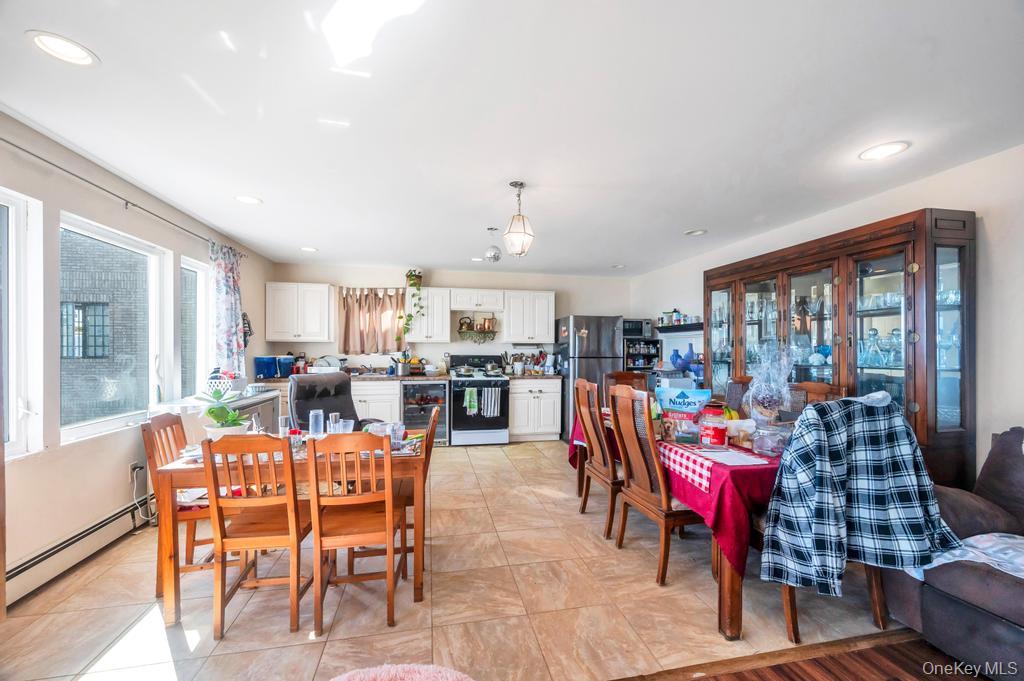 3142 Shore Road Bellmore, NY 11710 - Photo 6 of 24 a view of a dining room with furniture window and outside view