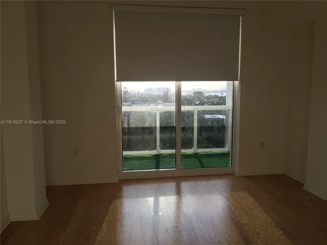 a view of outdoor space with wooden floor