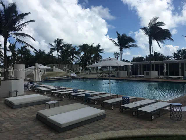 a view of a swimming pool with a patio