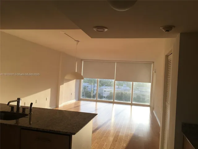 a view of a furniture and floor to ceiling window