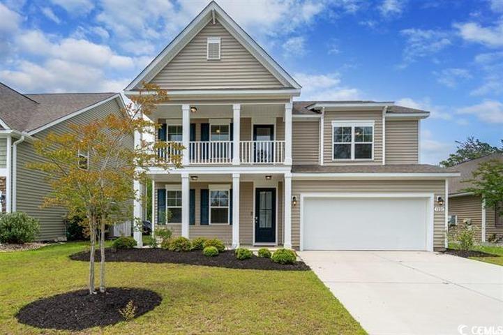 1221 Wind Swept Court Little River, SC 29566 - Photo 1 of 29 View of front facade with a garage, a balcony, and