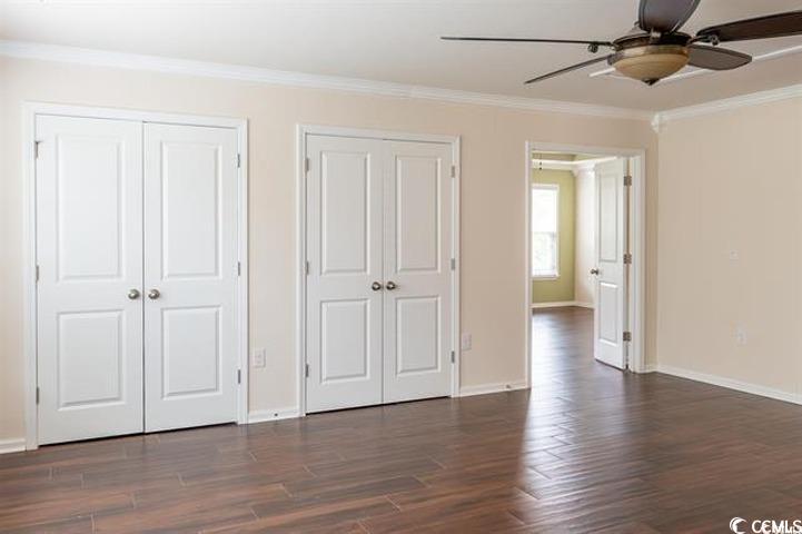 1221 Wind Swept Court Little River, SC 29566 - Photo 11 of 29 Unfurnished bedroom with multiple closets, ceiling