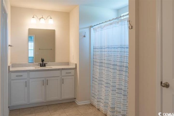 1221 Wind Swept Court Little River, SC 29566 - Photo 15 of 29 Bathroom with tile patterned floors, vanity, and w