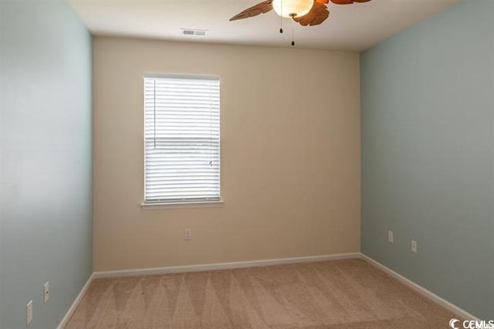 1221 Wind Swept Court Little River, SC 29566 - Photo 16 of 29 Spare room with light colored carpet and ceiling f