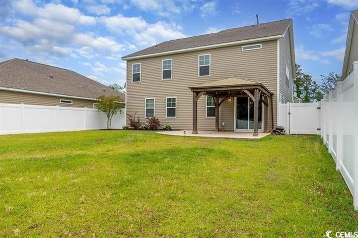 1221 Wind Swept Court Little River, SC 29566 - Photo 25 of 29 Back of property featuring a gazebo, a patio area,