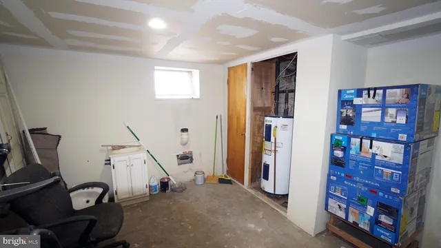 a view of a livingroom with furniture and staircase