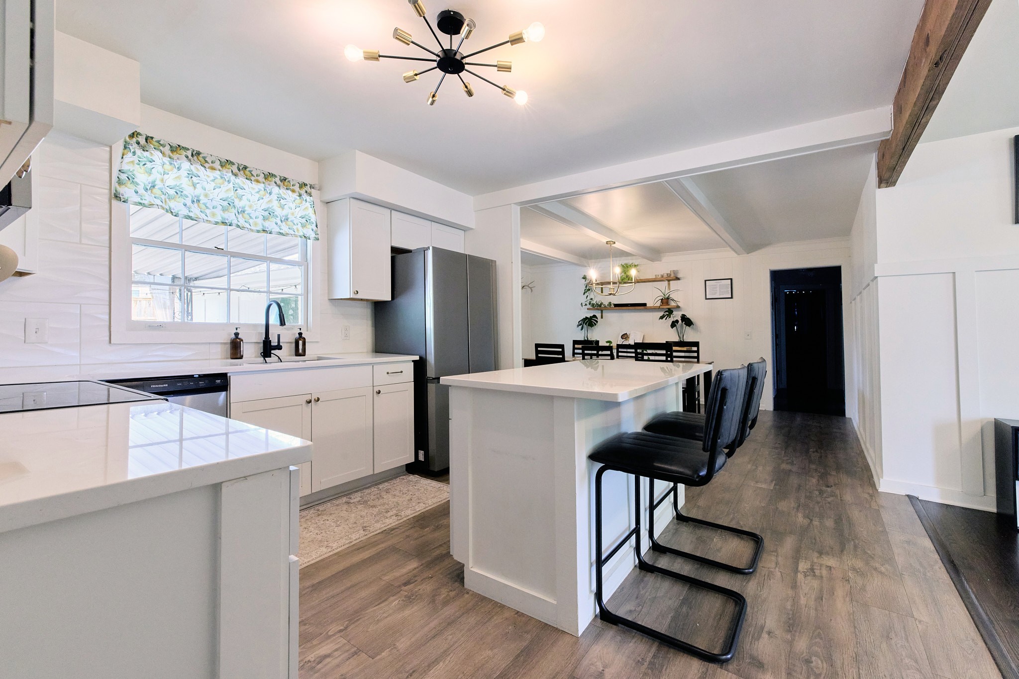 1250 Sioux Terrace Madison, TN 37115 - Photo 6 of 27 a kitchen with a refrigerator a sink dishwasher and a stove with wooden floor